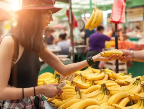 Woman buying bananas