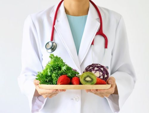 Nutritionist with plate of food