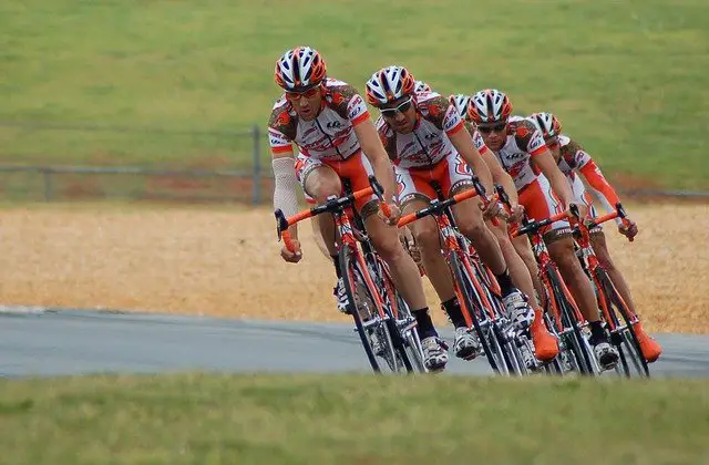 Four riders on road bikes taking part in a race