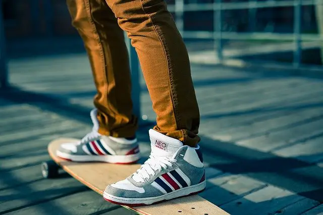 A skateboarder standing on a skateboard