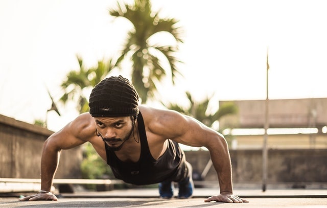 Man doing a pushup outside