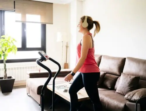 Woman using an affordable treadmill at home